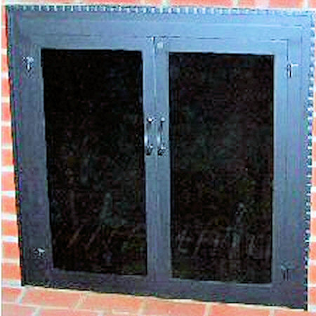 Buzzards Bay (Molding on surround)  All black finish, with heavy hammered molding, twin doors standard forged handles, smoke glass. Comes with slide mesh spark screen.